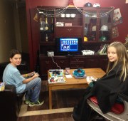 Though he doesn't cut girls' hair, Rusty did let Meg sit in the chair to play MarioKart on the Game Cube.  Notice the case of caps.